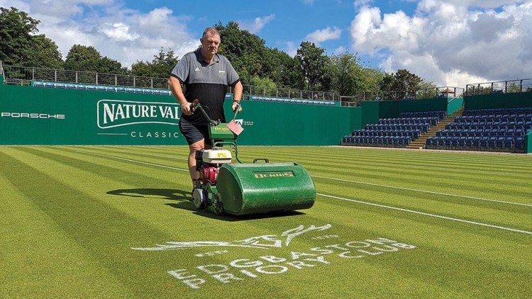 Centre Court being mown during the playing season by Grounds Manager, David Lawrence